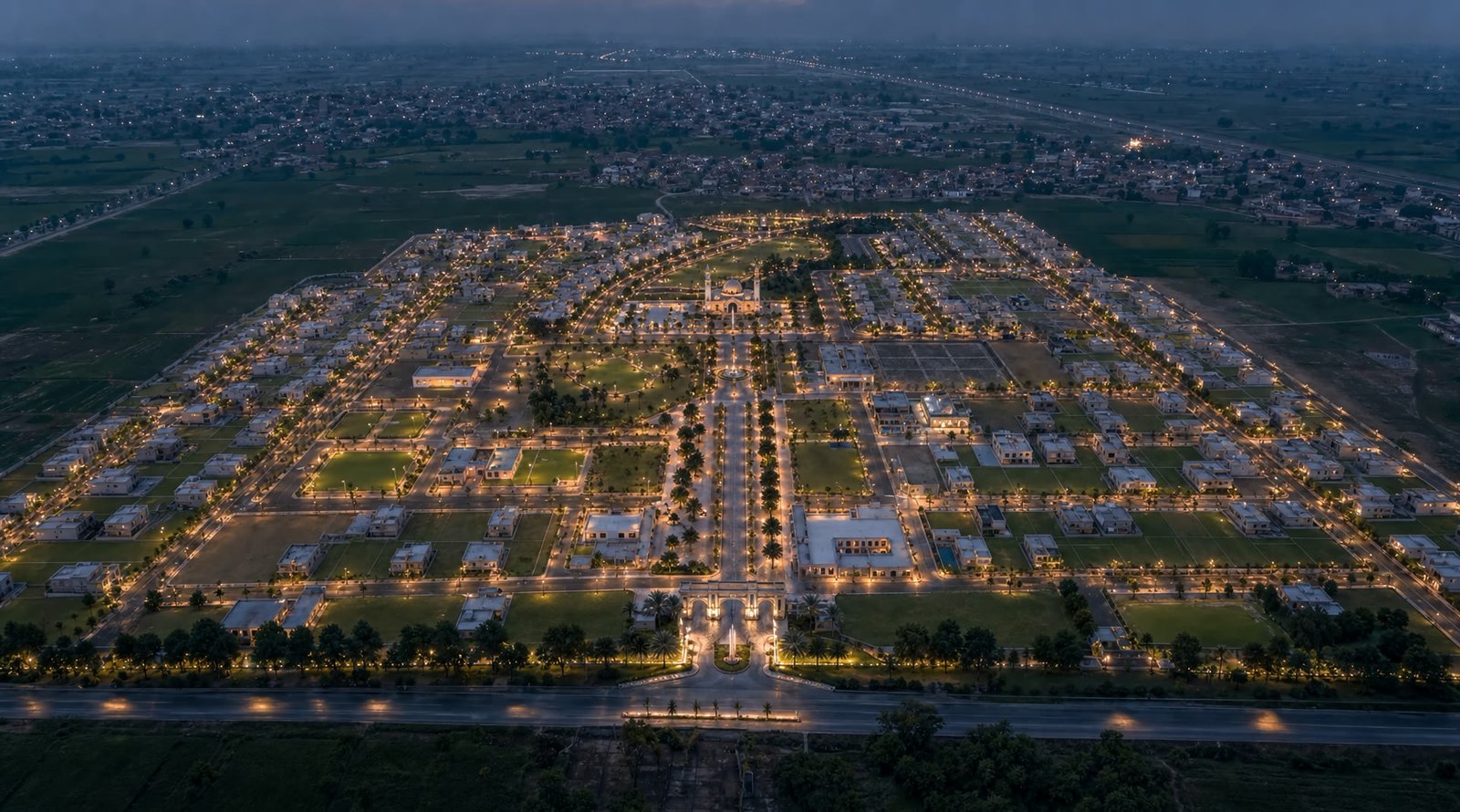 Aerial night view of the illuminated Nova Enclave masterplan